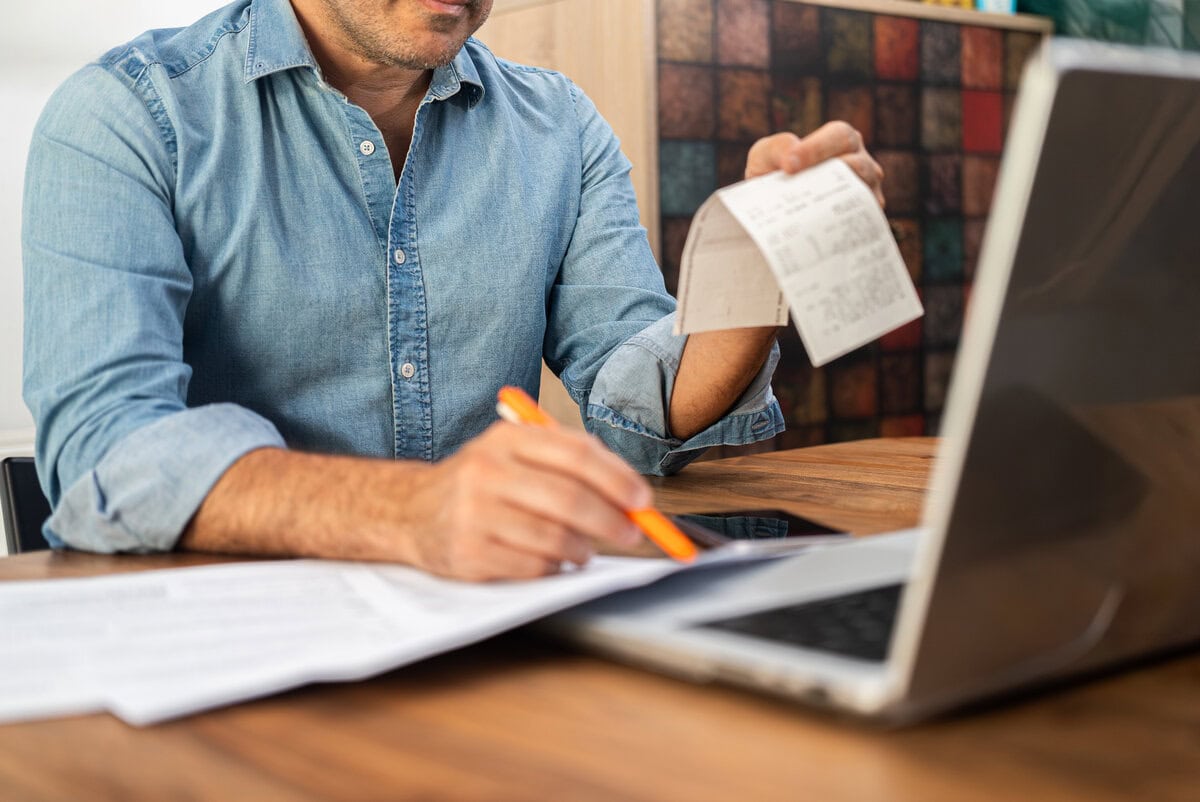 business owner reviewing receipts and prepping tax documents