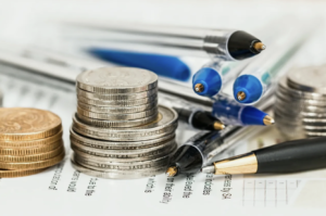 currency and pens symbolizing tax reduction planning